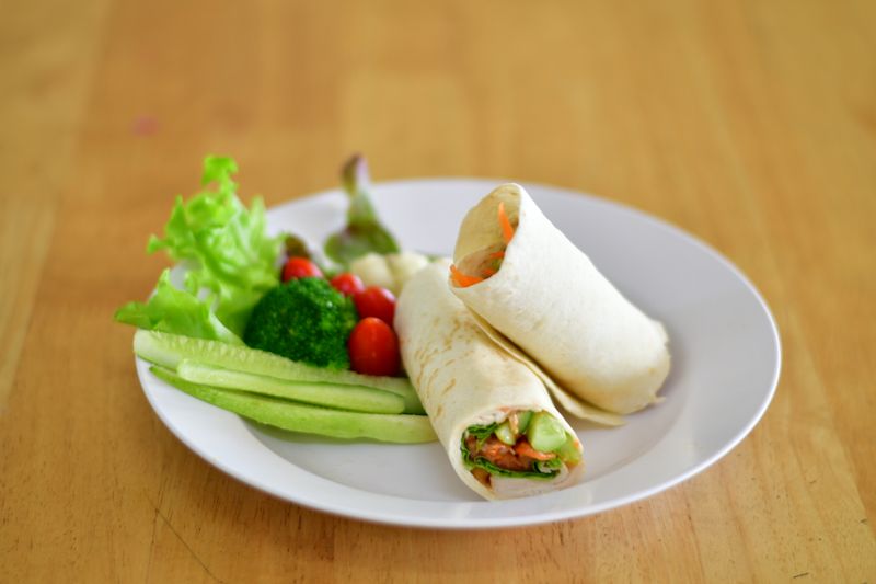 Mediterranean wrap with fresh vegetables and hummus